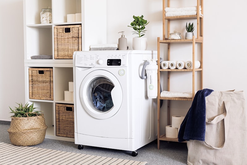 Clean organized laundry room with front-load washing machine